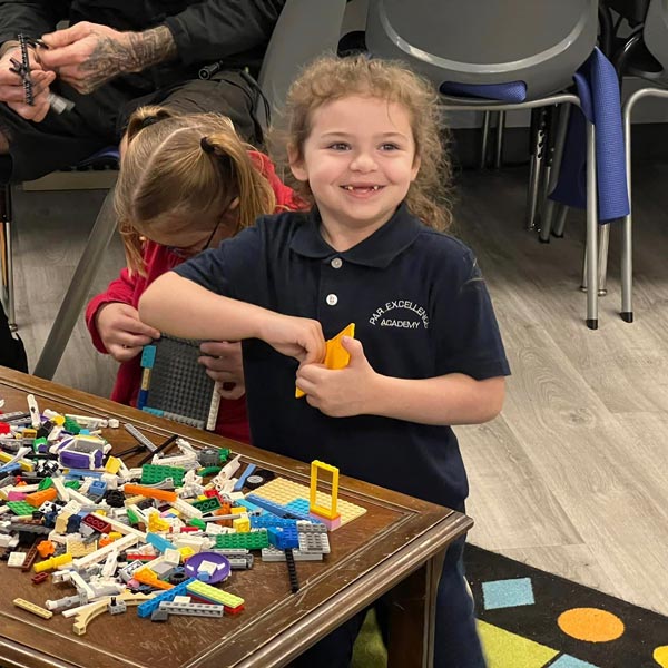 child playing with lego